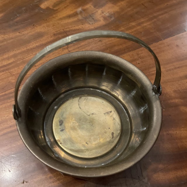 Lovely vintage brass basket with swinging handle.