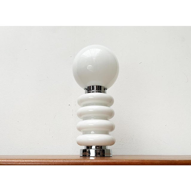 Imposing table or standing lamp according to a design by carlo nason from the 1960s. this lamp impresses with its...