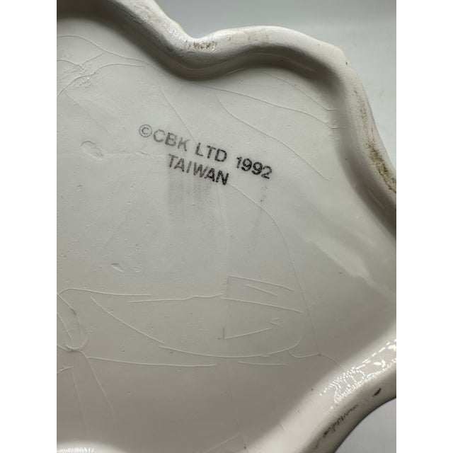 This lovely pitcher is shaped like a tree limb with sweet birds and leaves. Sure to be one of the prettiest pieces in your...