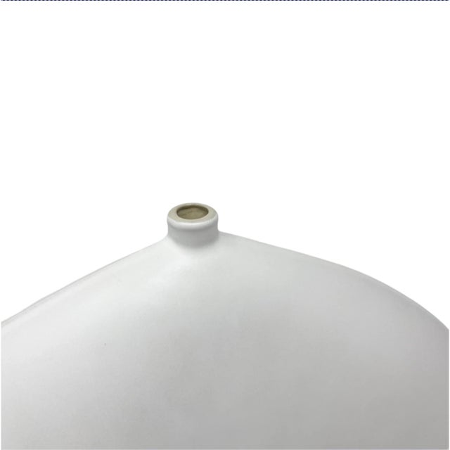 A handcrafted ceramic incense holder in a soft, matte white - textured, organic, and beautifully imperfect. The gentle...