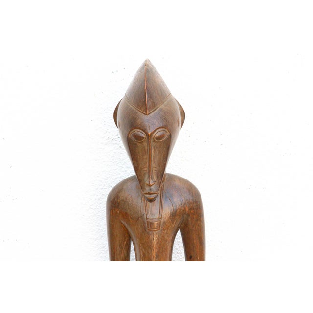 This elegant 42-inch figure originates from the Fang people, who inhabit the rainforest regions of Gabon, Equatorial...