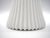 These window lamps combine discreet elegance with practical function. The white, fluted, conical lampshades diffuse a...