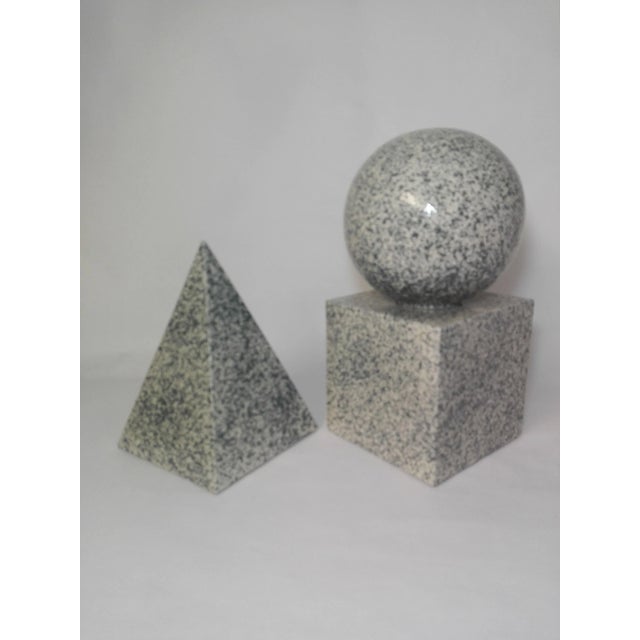 This spectacular geometrical ceramic set is painted with a stone effect finish.