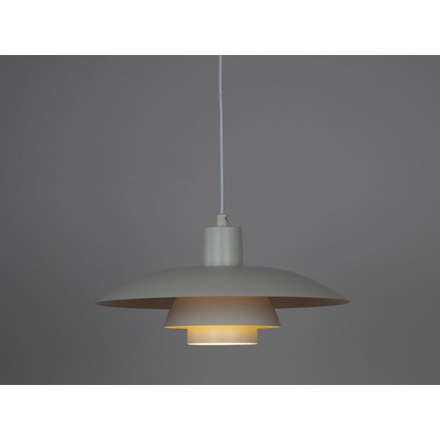 The ph 4/3 lamp is an absolute classic, designed by the renowned danish designer and architect poul henningsen. It has...