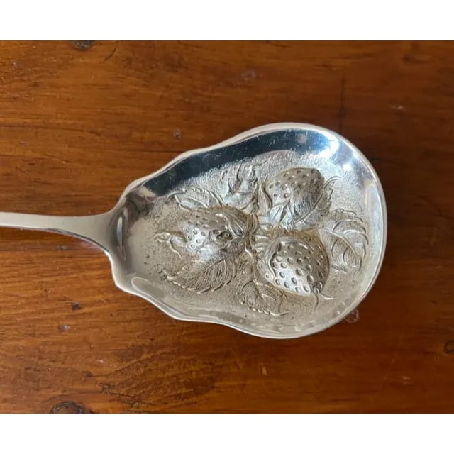 Stieff sterling silver large berry spoon with raised strawberries and leaves on the scalloped bowl in the Betsy Patterson...