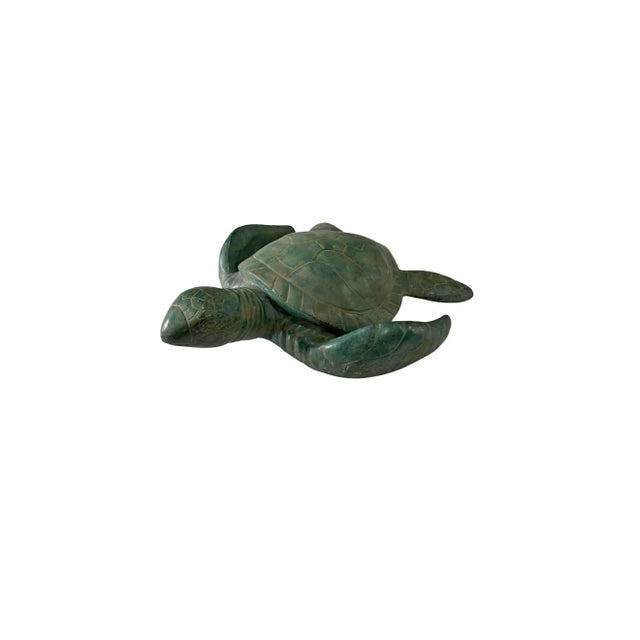 This solid brass tortoise is a finely crafted decorative object that celebrates patience, longevity, and enduring...