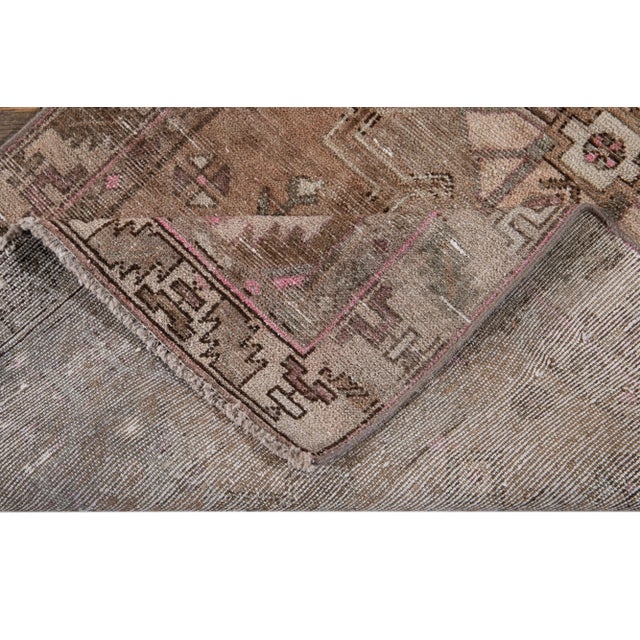 Beautiful vintage Malayer Persian hand-knotted wool runner with a brown field. This piece has multi-color accents with an...