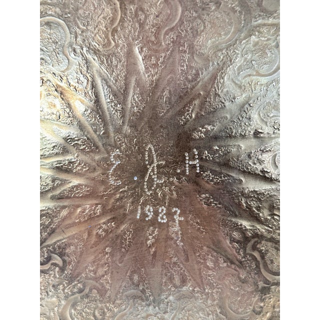 A beautifully etched solid brass tray featuring an intricate starburst center and layered floral and paisley border...