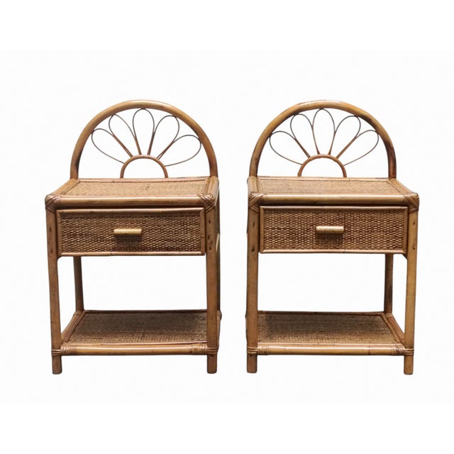 Beautiful pair of 1960s bedside tables made of natural rattan. The upper arch features a soft curve in Vienna straw, a...