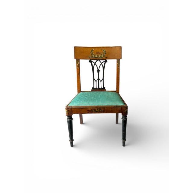 This is an antique English child’s chair. The back is hand painted with a traditional laurel motif and a commemorative...
