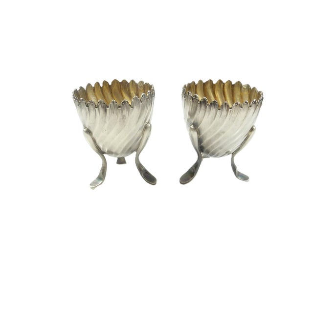 A fine pair of antique French sterling silver egg cups crafted in the elegant Louis XV/Rococo style. Each cup is...