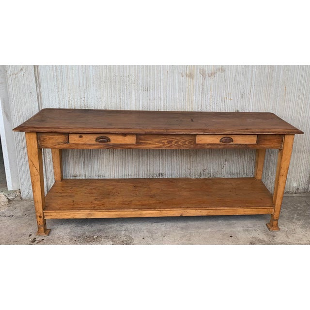 A charming early 20th century Spanish butcher block table with six legs and a wonderfully well-worn finish from a century...