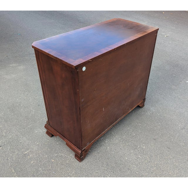 This is an exceptional mahogany chest of drawers by Baker Furniture, embodying timeless elegance and superior...