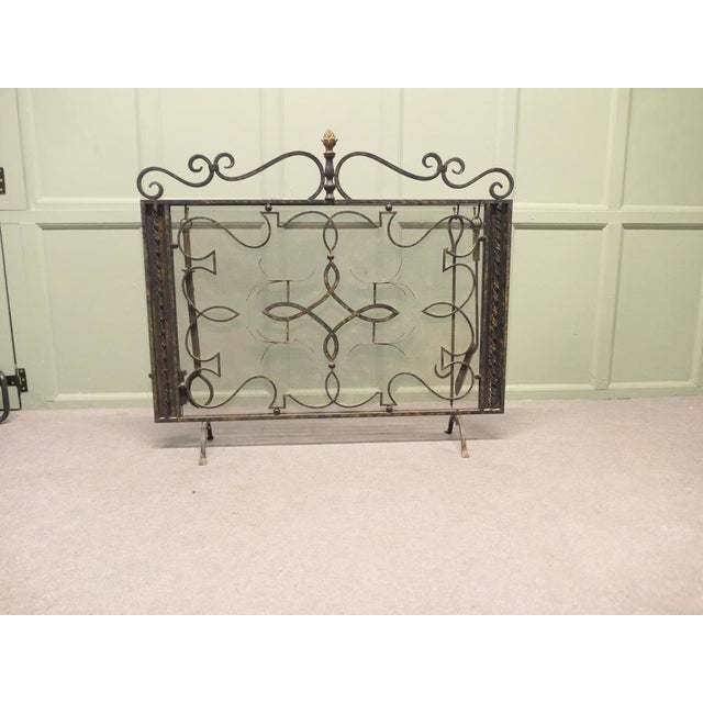 Very attractive piece and unusually large, the wrought iron work is curvy with a fine mesh infill backing and on the back...