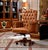 Command attention with this impressive executive office chair, beautifully upholstered in rich cognac-brown leather. Deep...