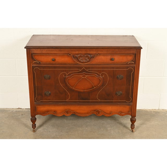 A beautiful antique Art Deco three-drawer dresser or chest of drawers In the manner of Berkey & Gay USA, Circa 1930s...