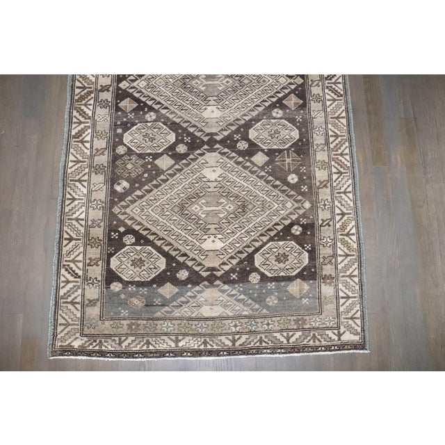 An early 20th century Persian Malayer geometric runner in browns and gray tones