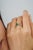 Crafted in 925 sterling silver, this elegant cluster ring features octagon and marquise-cut emeralds totaling 0.77 carats,...