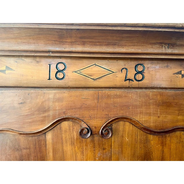 This piece is crafted from hand-carved walnut and features original hardware. The cabinet is very spacious with two doors...