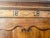This piece is crafted from hand-carved walnut and features original hardware. The cabinet is very spacious with two doors...