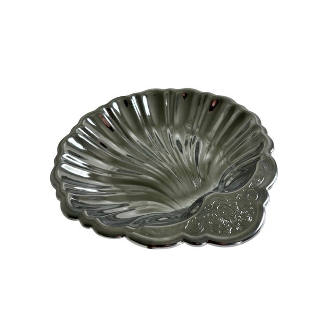 Vintage Late 20th Century Coastal Hollywood Regency clam shell small serving dish/bowl in a metal chrome polished finish....