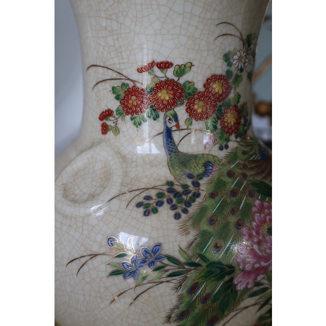 This elegant, hand-painted vintage Japanese porcelain baluster vase is curated by Andrea by Sadek. The front display...