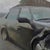Early 21st Century Camp Washington Caddy by Brad Davis | Oil on wood panel Black car with damage parked on street For Sale - Image 5 of 5