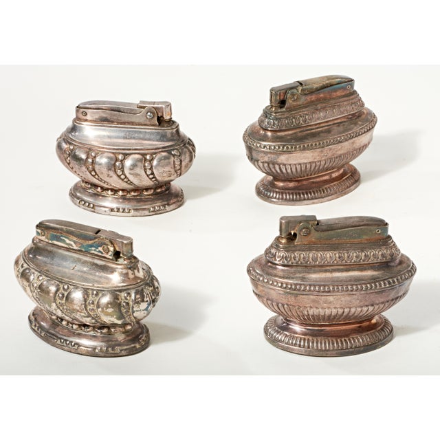 Two Ronson "Crown" Two Ronson "Queen Anne" They do not contain lighter fluid.