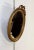 Charming oval mirror in golden wood with Louis XVI style, topped with a large knot made up with a large chopped ribbon....