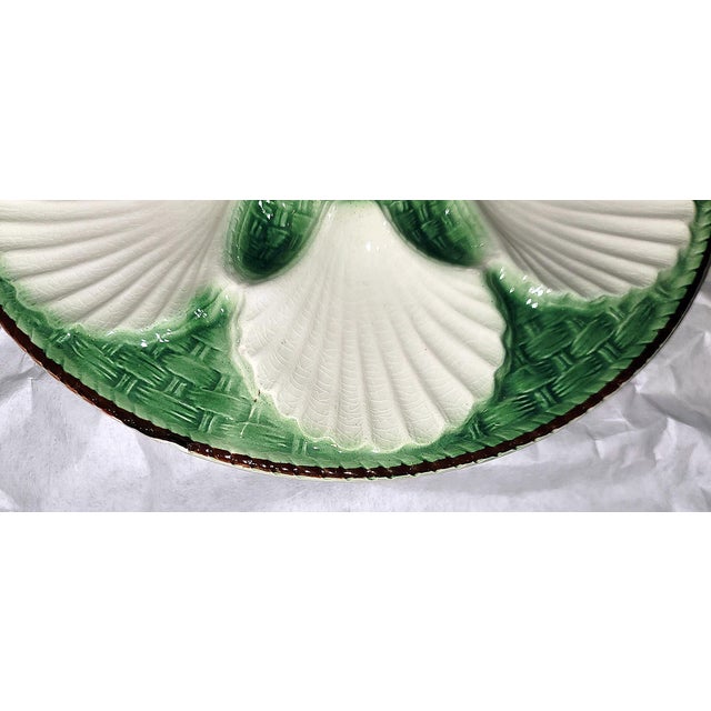 Majolica, as popular today as ever, this French St. Clement oyster plate is vibrant in it's green glaze, fine condition...