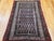 "This elegant early 20th century Persian Malayer area rug features a striking allover paisley motif, a design prized for...