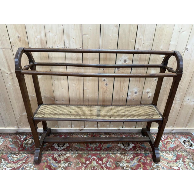 A napoleon iii period garment rack, second half of the 19th century, made of dark mahogany-stained wood and woven cane....