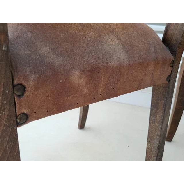 Correct state. Many traces of use, a flash of wood on one foot. Perforations at the rear of a leather seat. A recolled...