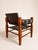 Danish safari lounge chair in faux leather and wood, 1960s.