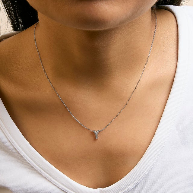 Elegance meets personalized charm in this exquisite pendant, meticulously crafted from radiant 10K white gold with a...