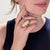 A fine 1970s handmade studio cocktail ring. In 14k yellow gold. Bezel set to the center with a very large angel skin coral...