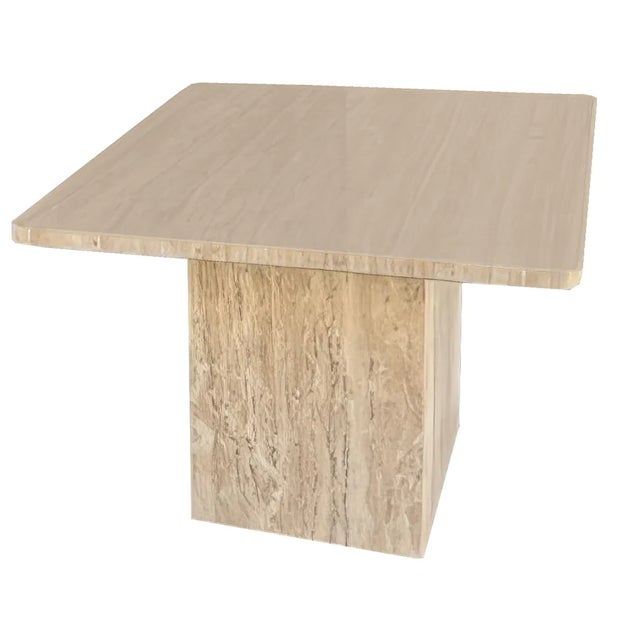 A vintage 1980s travertine marble side table in impeccable shape. This pedestal table has rounded top corners and a...