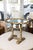This is an elegant Italian Baroque-style low table featuring a shaped rectangular top with a molded gilt border...