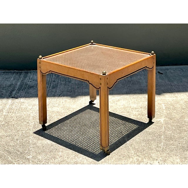 This sophisticated 1970s drinks table is a masterclass in Hollywood Regency elegance with a distinct Chinoiserie...