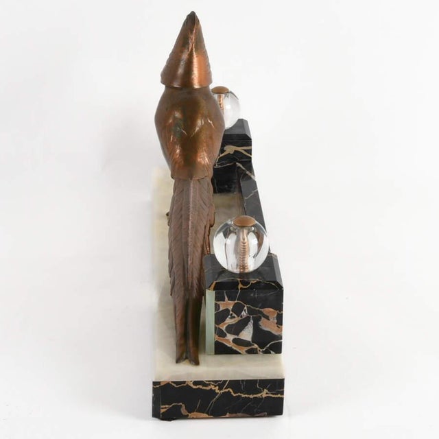 This Art Deco Pheasant Mantel Sculpture is a refined decorative object that captures the streamlined elegance and...