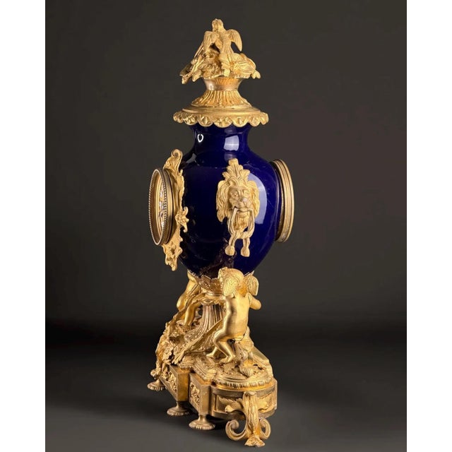 A magnificent Napoleon III period mantel clock, dating to around 1865–1875, crafted in deep bleu de Sèvres porcelain and...