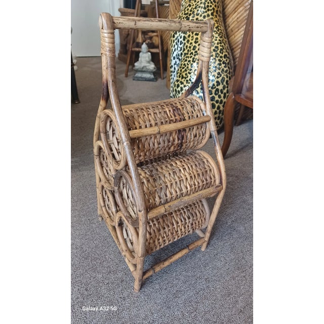 Vintage boho sculptural rattan wine rack. Rack holds 5 bottles or wine and would be great for your countertop.