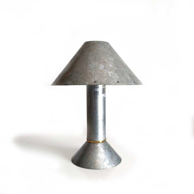 Authentic postmodern table lamp by Los Angeles designer Ron Rezek, Model 4200, circa 1980s. Galvanized steel construction...