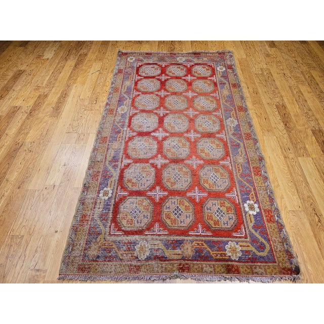 This exquisite 19th-century Khotan rug originates from Eastern Turkestan, a historic crossroads of Silk Road artistry....
