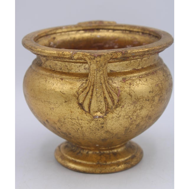 A stunning Italian gold leaf gilt terra cotta ceramic cachepot/planter with lovely natural patina. This is such a...