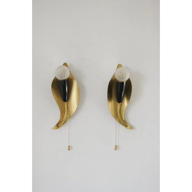 A pair of mid-century, 1950s wall sconces, Very elegant and minimalist wall lamps. Timeless Italian design at its best. Up...
