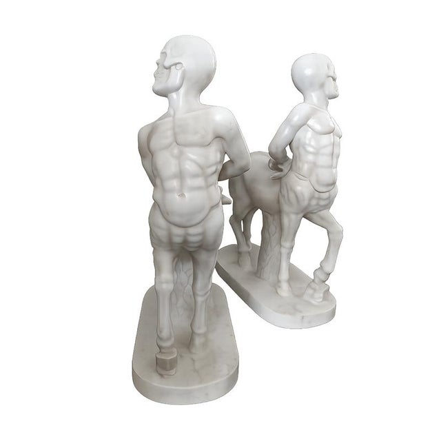 This elegant pair of centaurs sculpted in marble combines the allure of classical mythology with the refinement of...