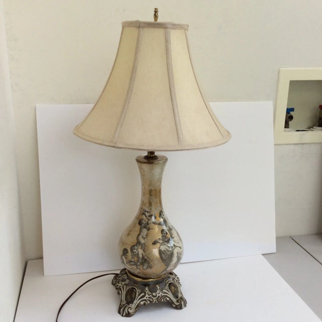 Great looking glass lamp with interior applied black and white 18th Century style engravings and gold and silver in areas...