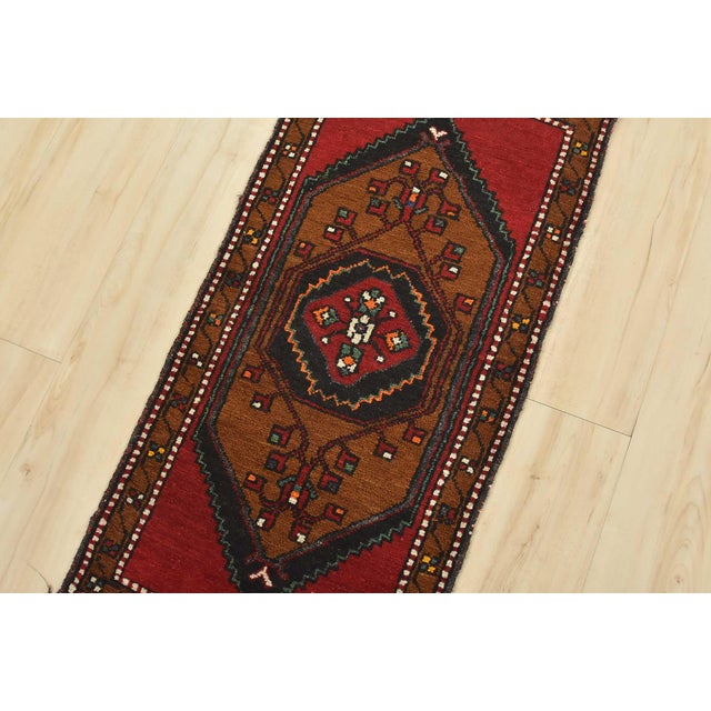 An authentic vintage tribal Malatya rug hand-knotted with fine wool and natural dyes. This nomadic oriental rug features a...