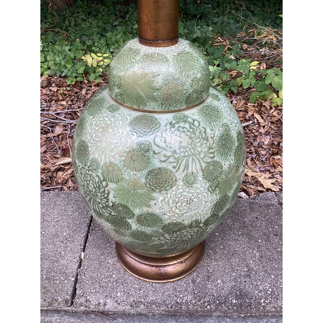 Bring a touch of timeless elegance to your space with this striking vintage porcelain table lamp featuring an all-over...
